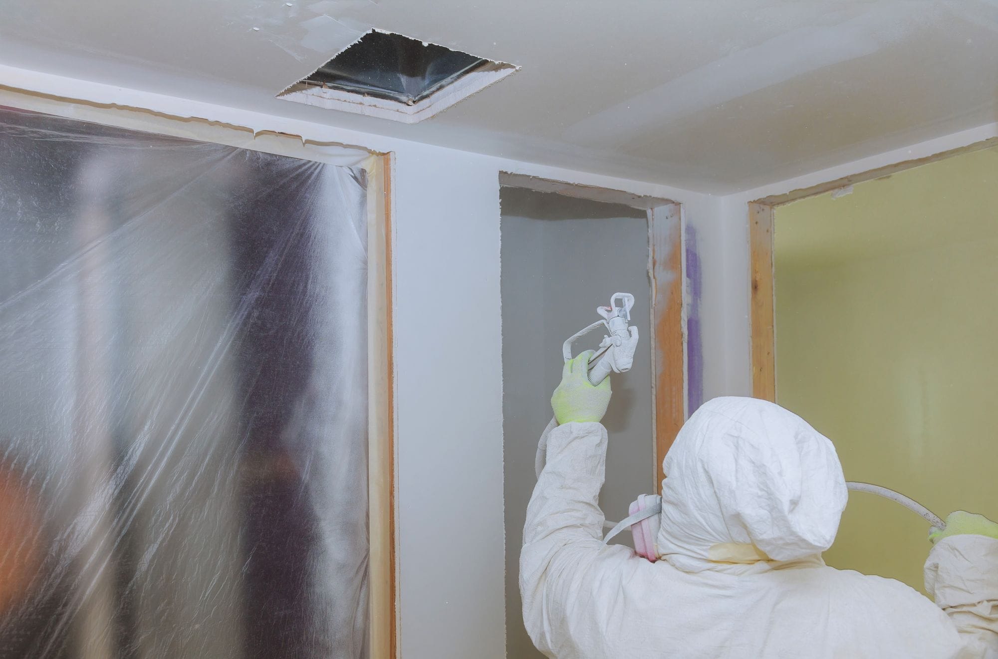 worker-painting-wall-with-spray-gun-in-white-color-2025-03-27-03-33-31-utc